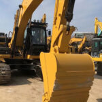 CAT 320D excavator with high performance, ideal for construction projects, featuring a powerful engine.