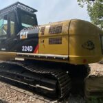 CAT 324 excavator showcasing bucket options and specifications.