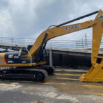 CAT 330 and CAT 320D excavators, showcasing UHD specs and various used options.