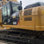 CAT 330 and CAT 320D excavators, showcasing UHD specs and various used options.